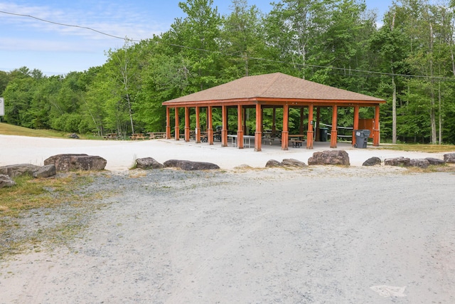 view of property's community featuring a forest view and a gazebo