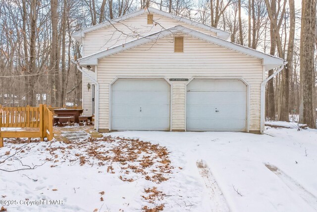 view of snow covered garage