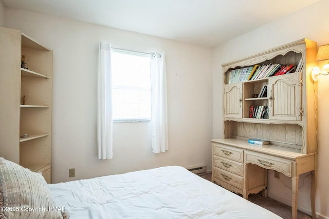 bedroom featuring a baseboard heating unit