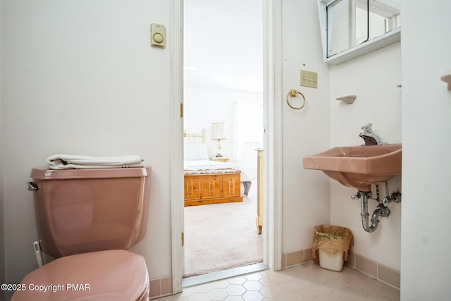 bathroom with toilet and sink