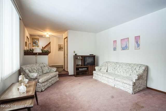 carpeted living room with a baseboard radiator