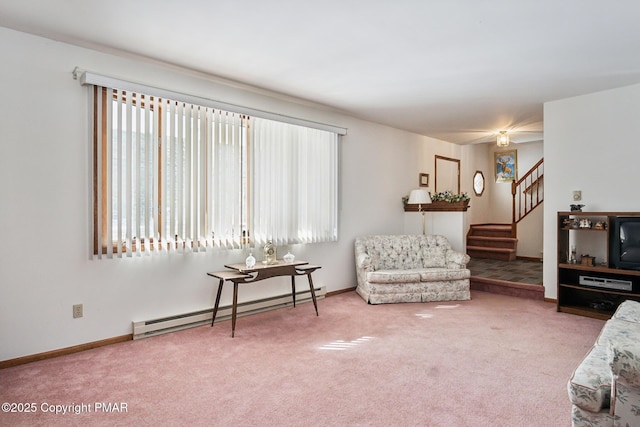 carpeted living room with a baseboard heating unit