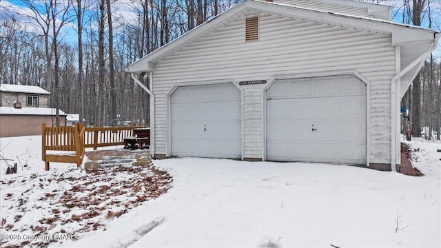 view of snow covered garage