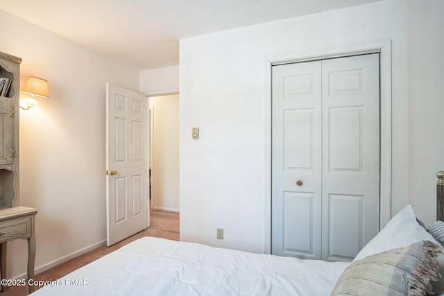 carpeted bedroom with a closet