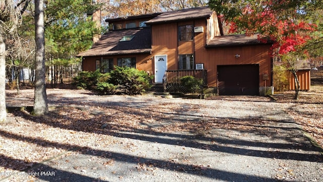 view of front facade with driveway and an attached garage