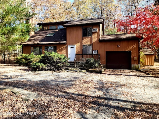 view of front of property featuring driveway and an attached garage