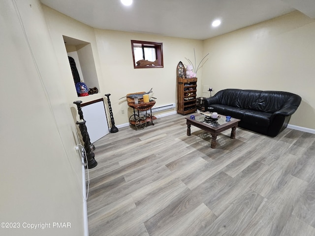 living room featuring recessed lighting, baseboards, and wood finished floors