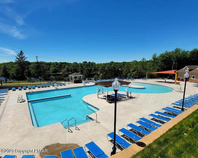 community pool with a patio