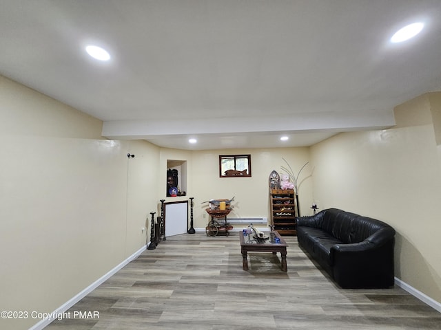 living area featuring light wood finished floors, baseboards, and recessed lighting