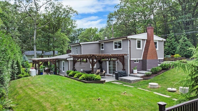 262 Marilou Ln, Bartonsville, PA 18321 - rear view of property with a pergola, a chimney, a lawn, a patio, and view of wooded area