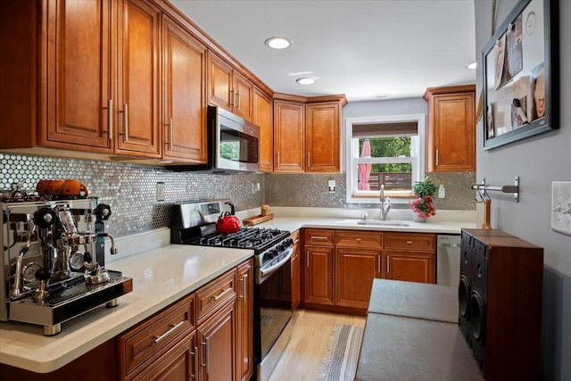 262 Marilou Ln, Bartonsville, PA 18321 - kitchen featuring stainless steel appliances, brown cabinetry, light wood-type flooring, and recessed lighting