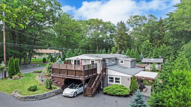 262 Marilou Ln, Bartonsville, PA 18321 - view of front facade with stairway, a deck, a chimney, a front yard, and driveway