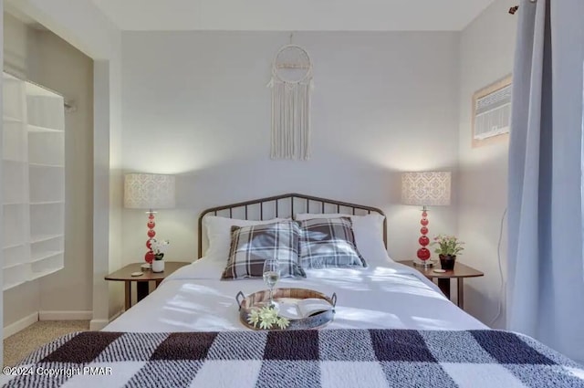 carpeted bedroom featuring baseboards