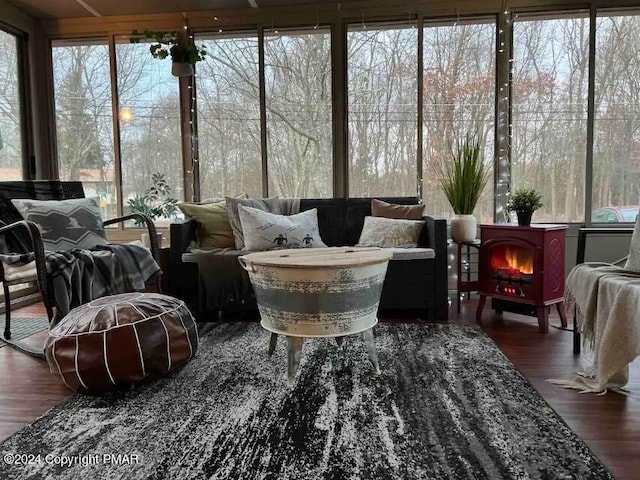 sunroom / solarium with a wood stove