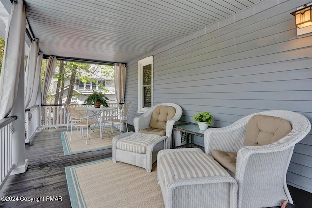 wooden terrace with outdoor dining space