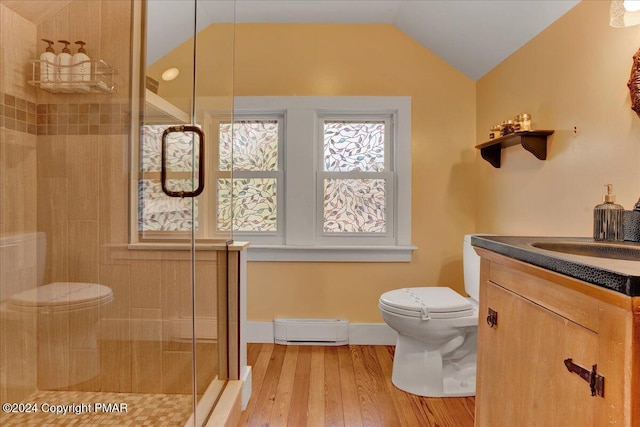 full bath with lofted ceiling, toilet, a baseboard heating unit, a shower stall, and wood finished floors