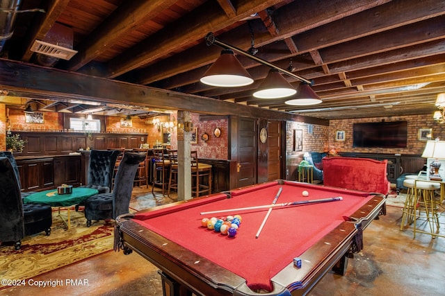 playroom with a dry bar, billiards, brick wall, and unfinished concrete floors