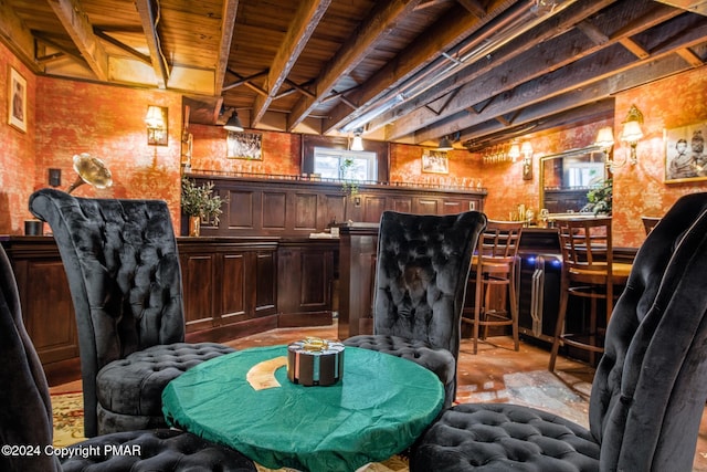 bar with a bar, wooden ceiling, and beam ceiling