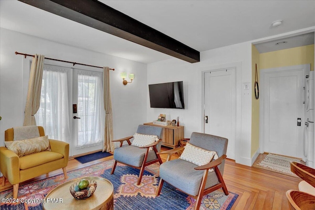 living room with beam ceiling