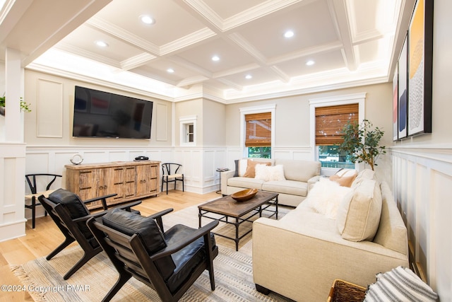 living area with light wood finished floors, a decorative wall, beamed ceiling, and recessed lighting