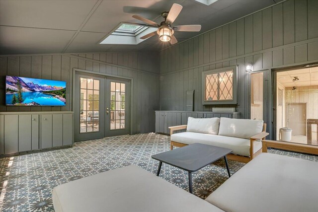 171 Flintlock Trl, Pocono Pines, PA 18350 - kitchen with light wood-type flooring, lofted ceiling, a stone fireplace, pendant lighting, and baseboards