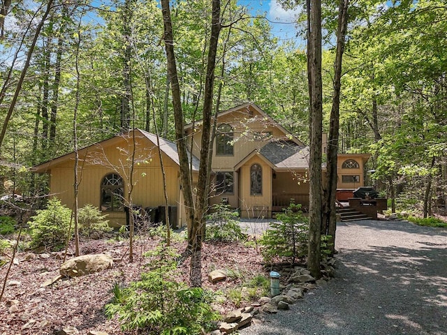 171 Flintlock Trl, Pocono Pines, PA 18350 - chalet / cabin with roof with shingles and a forest view