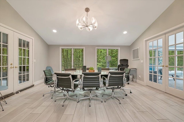 171 Flintlock Trl, Pocono Pines, PA 18350 - dining area featuring french doors, lofted ceiling, plenty of natural light, light wood finished floors, and recessed lighting