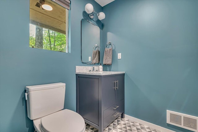 171 Flintlock Trl, Pocono Pines, PA 18350 - bathroom with vanity, toilet, tile patterned floors, and baseboards