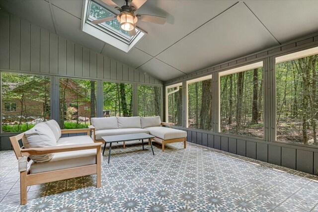 171 Flintlock Trl, Pocono Pines, PA 18350 - kitchen with stainless steel electric range oven, under cabinet range hood, light wood-type flooring, plenty of natural light, and vaulted ceiling