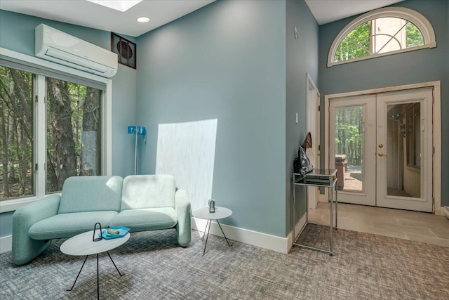 171 Flintlock Trl, Pocono Pines, PA 18350 - living area featuring a wall mounted air conditioner, french doors, healthy amount of natural light, baseboards, and recessed lighting