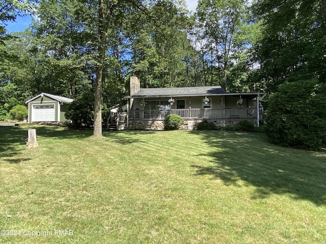 view of yard featuring covered porch and an outdoor structure