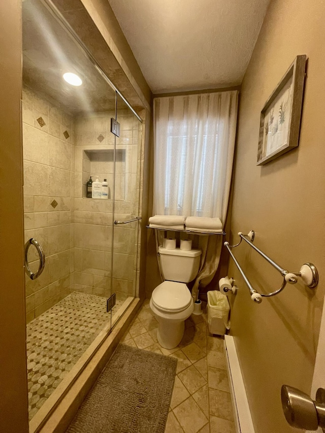 5144 Hounds Ear Rd, Tobyhanna, PA 18466 - full bath featuring a shower stall, tile patterned floors, and toilet