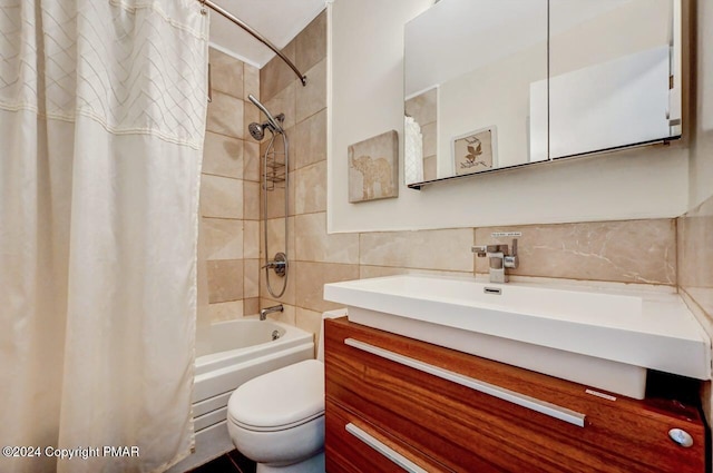 bathroom with toilet, shower / tub combo, tile walls, and vanity