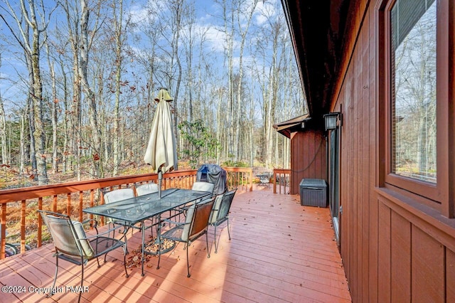 deck with outdoor dining area