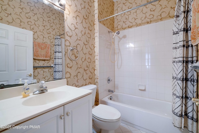 bathroom with vanity, shower / bath combo with shower curtain, toilet, and wallpapered walls