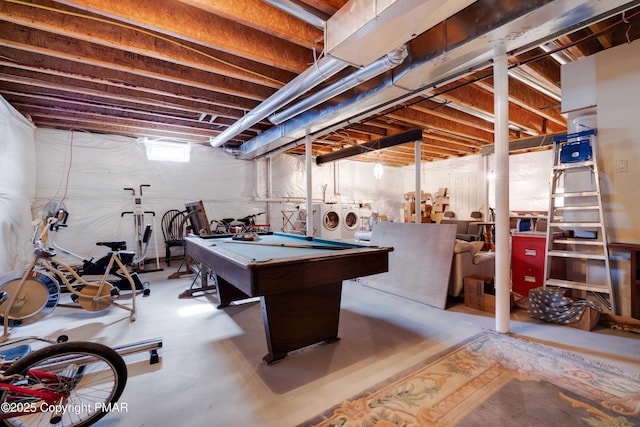 rec room featuring pool table, concrete floors, and washer and clothes dryer