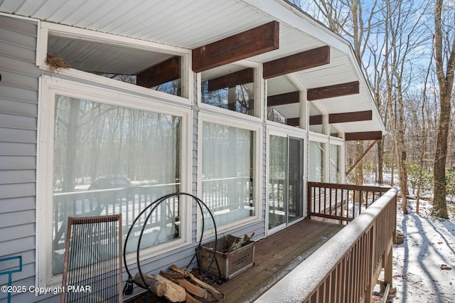 view of snow covered deck