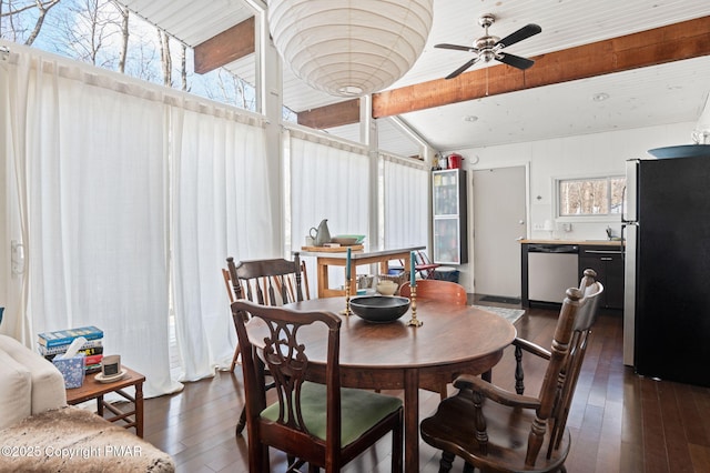 dining room featuring lofted ceiling, dark wood-type flooring, and a ceiling fan