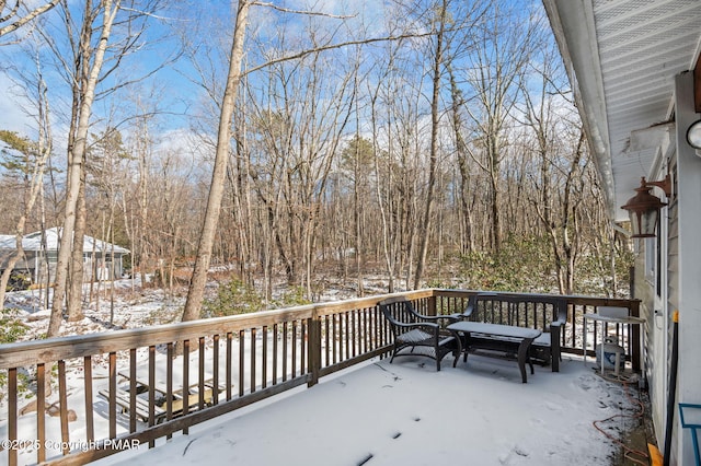 view of snow covered deck