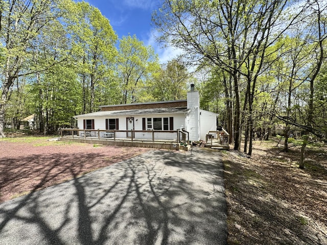 338 Tower Rd, Albrightsville, PA 18210 - view of front of house with a deck, driveway, and a chimney