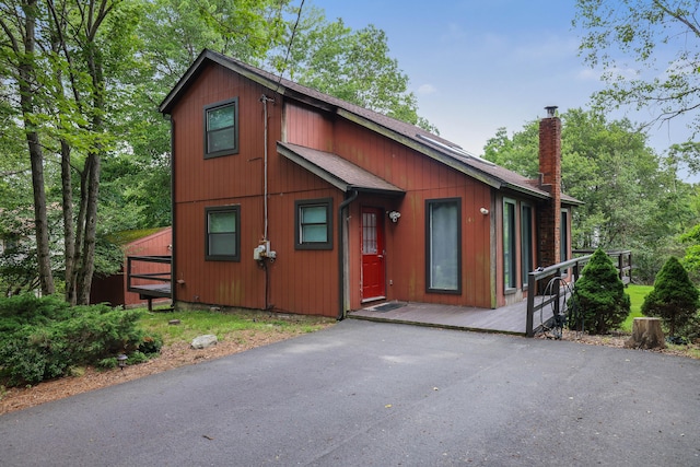 144 Island Dr, Long Pond, PA 18334 - rustic home with a chimney and roof with shingles