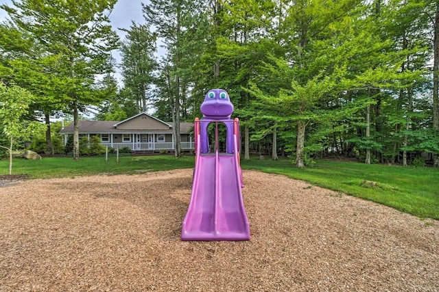 community jungle gym with a lawn