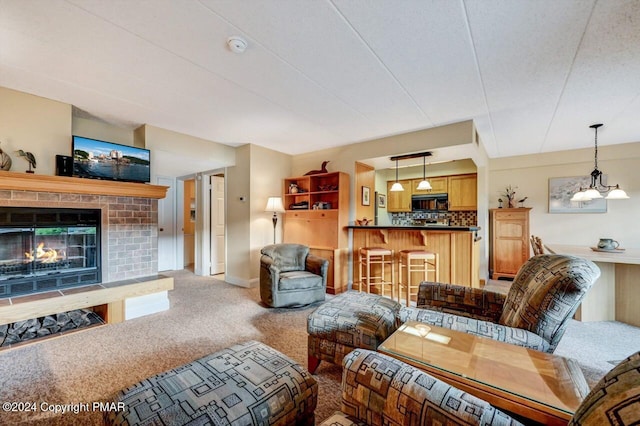 carpeted living area with a fireplace