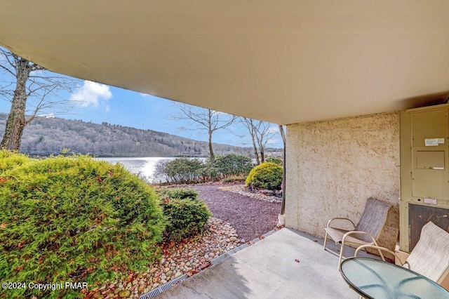 view of patio / terrace with a water view