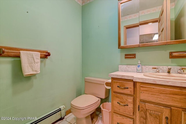 bathroom featuring a baseboard radiator, vanity, and toilet