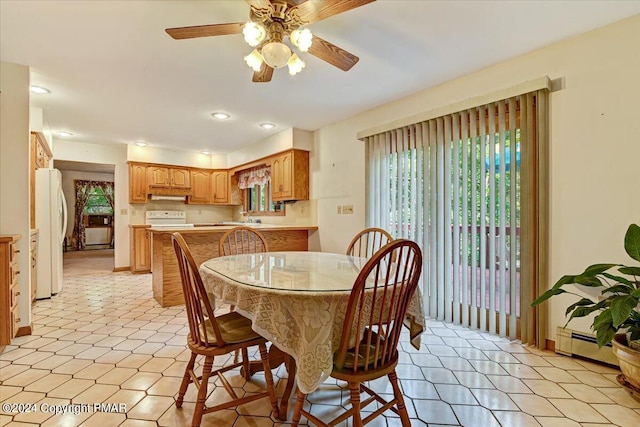 dining room featuring a baseboard radiator, a ceiling fan, and recessed lighting