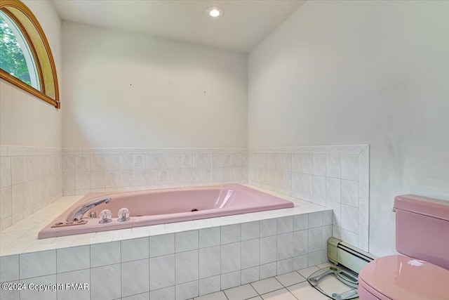 bathroom with toilet, tile patterned flooring, baseboard heating, and a whirlpool tub