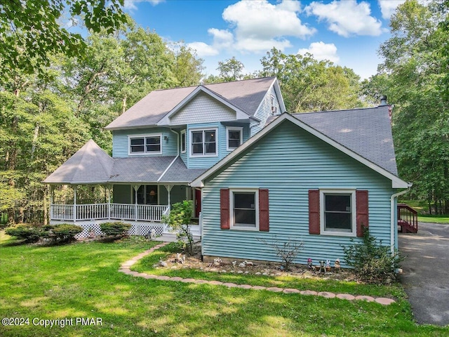 view of front of property with a porch and a front yard