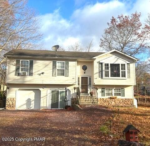 split foyer home featuring a garage