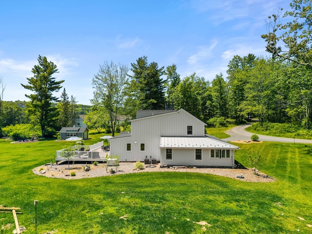 5126 Beattys Cir, Buck Hill Falls, PA 18323 - back of house with a wooden deck, a yard, a metal roof, and an outbuilding